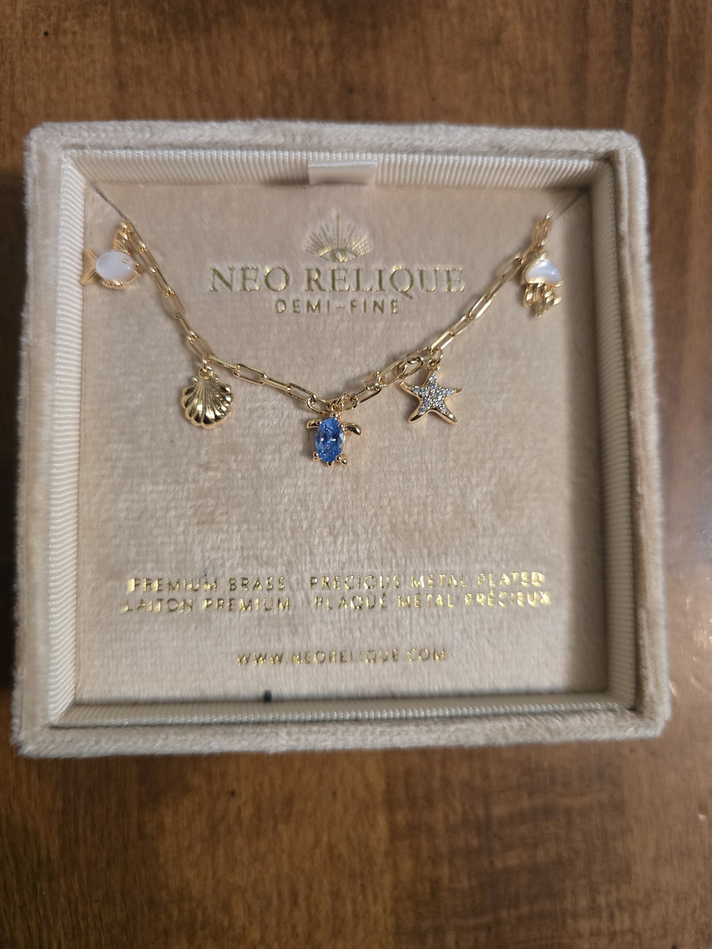 Neo Relique Gold Charm Necklace with Blue Crystal Turtle